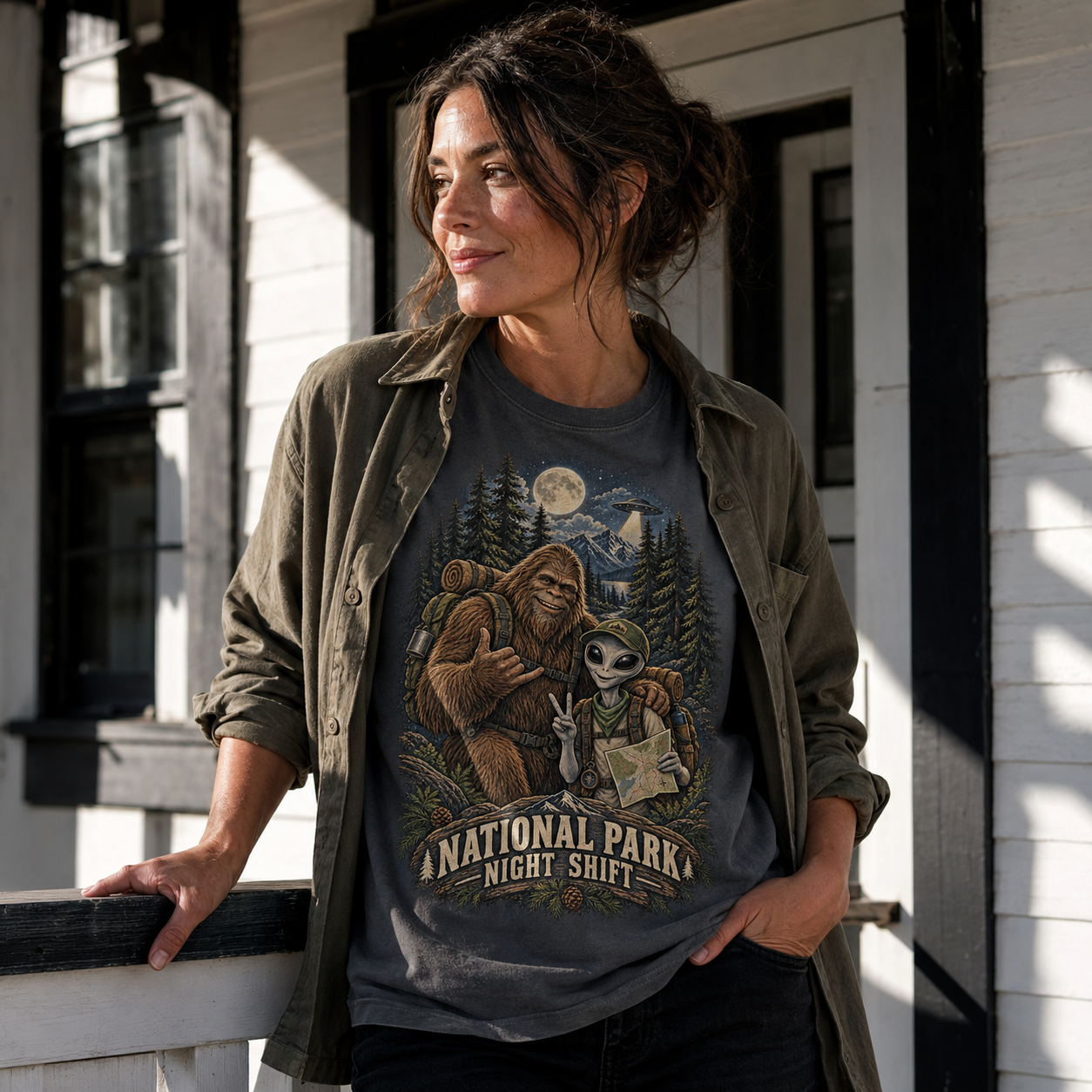 Model wearing the Graphite National Park Night Shift tee on a ranger porch