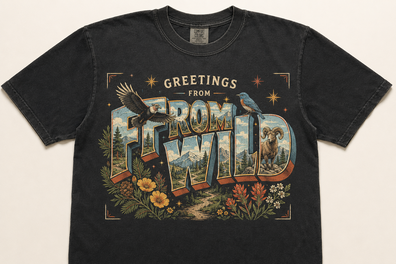 Greetings From the Wild graphic on a black garment-dyed tee