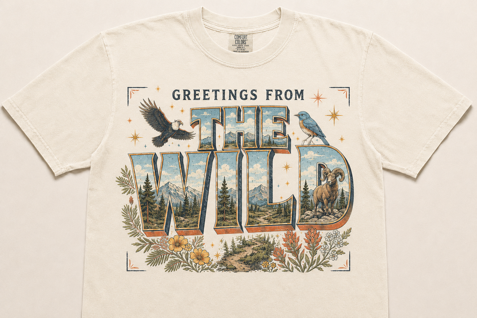 Greetings From the Wild nature graphic on an ivory Comfort Colors tee