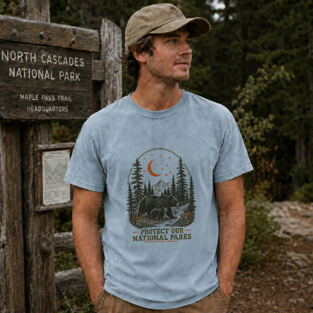 Man wearing Moonlit Bear national parks tee in Chambray at trailhead
