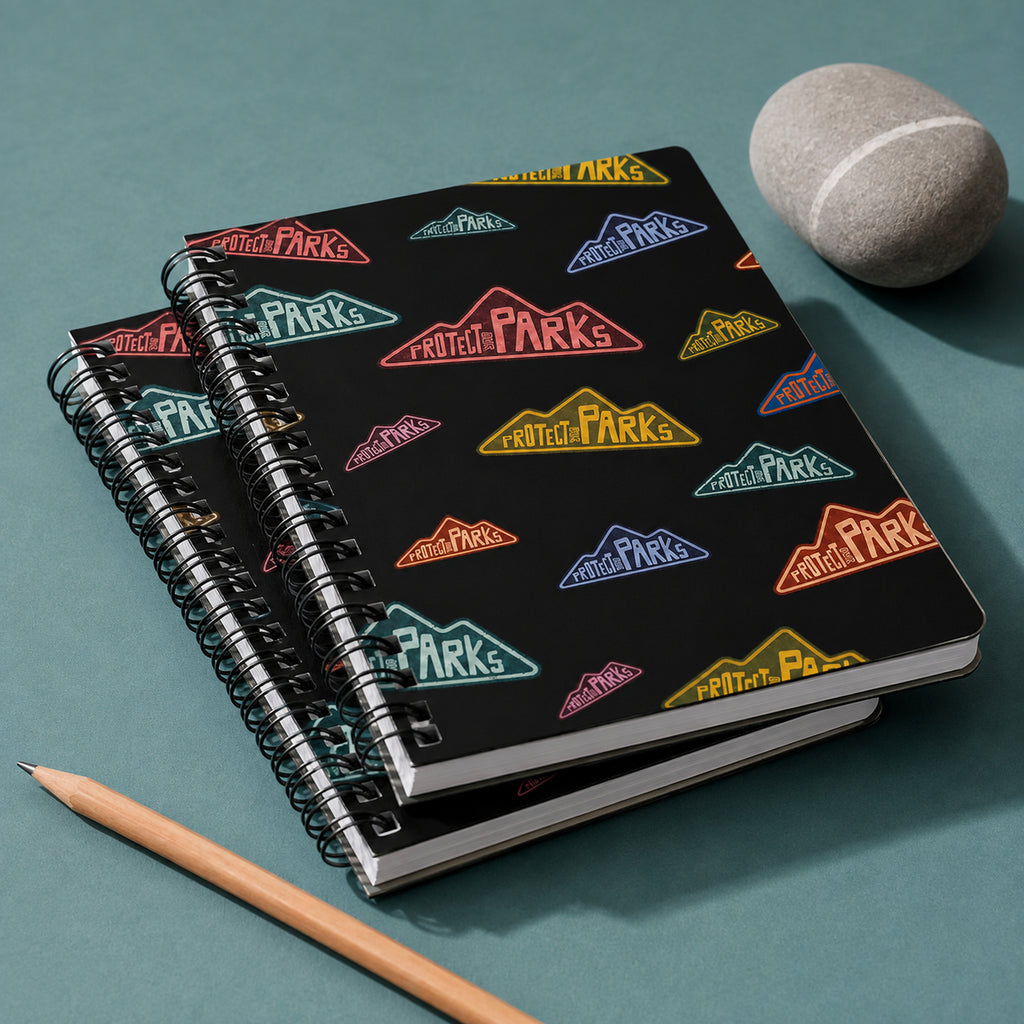 Protect Our Parks black spiral notebook — stacked binding edge