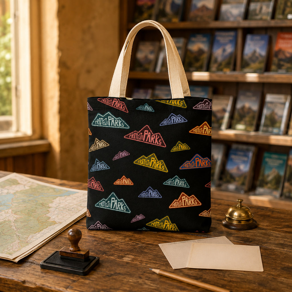 Protect Our Parks black all-over-print tote — visitor center desk