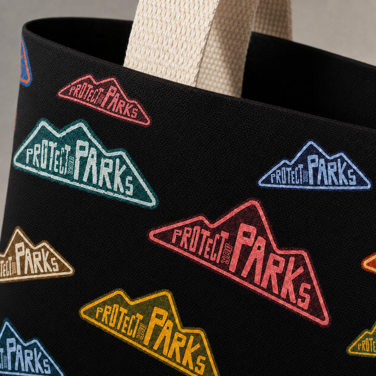 Close-up of Protect Our Parks tote fabric with clean inside handle attachment