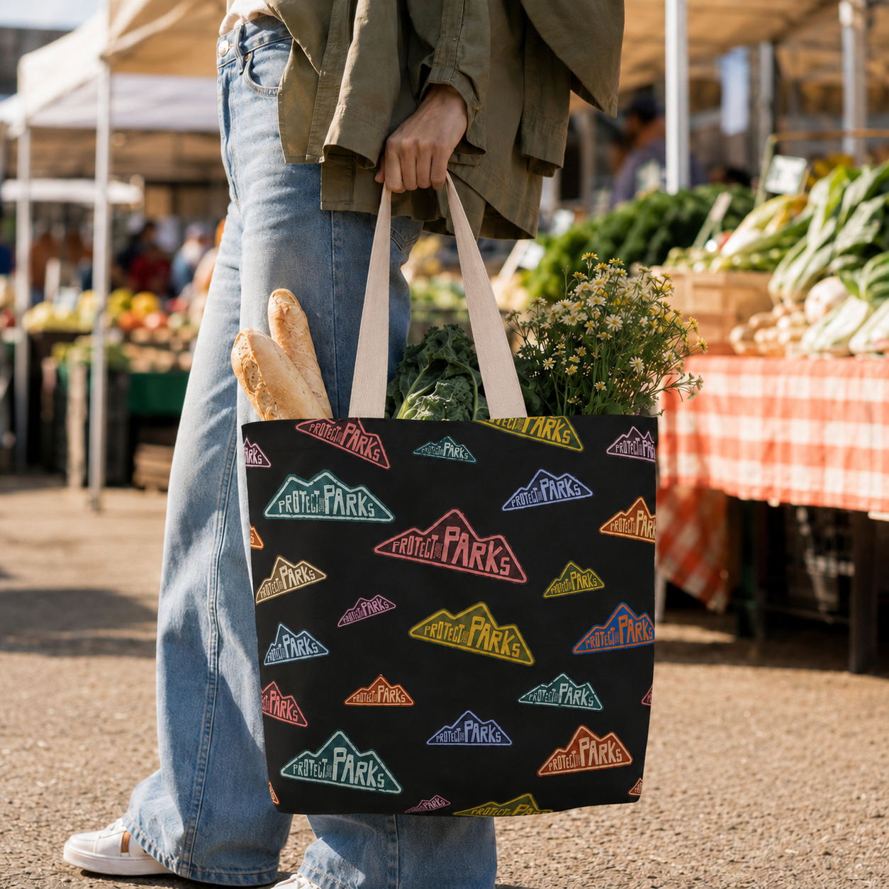 Protect Our Parks tote carried at an outdoor market with handles attached inside