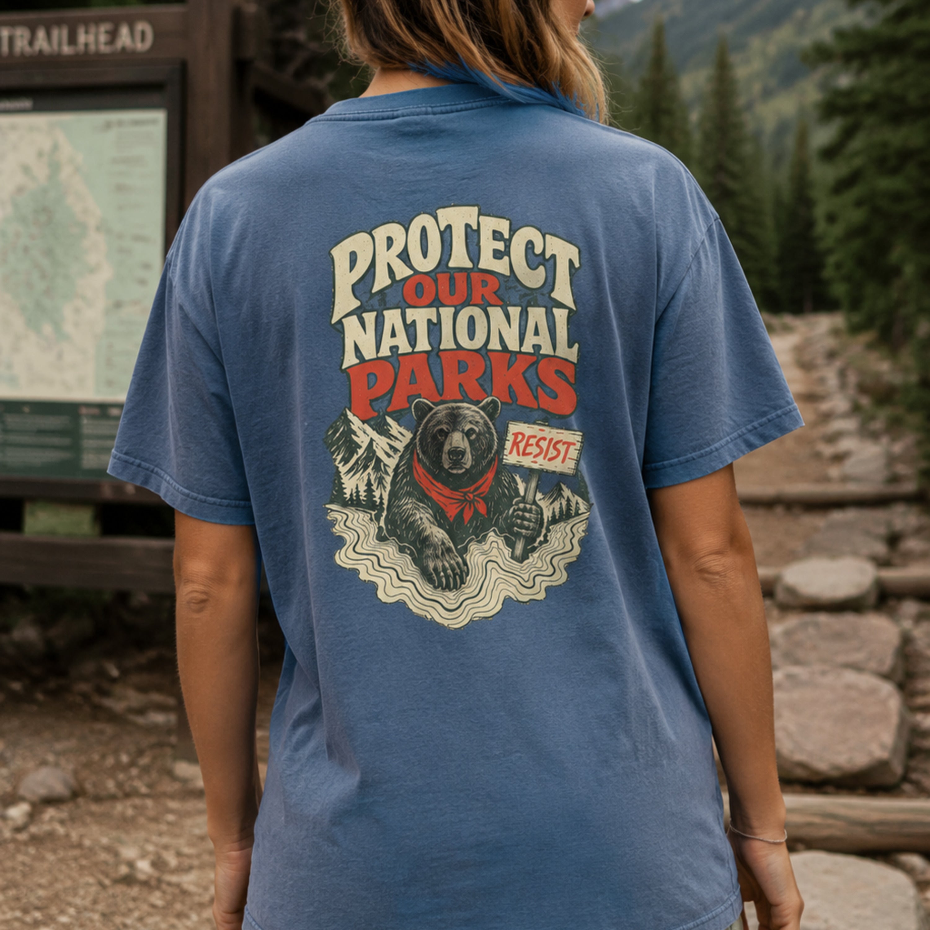 Model wearing Resist Bear Protect Our National Parks Comfort Colors 1717 Blue Jean tee from back
