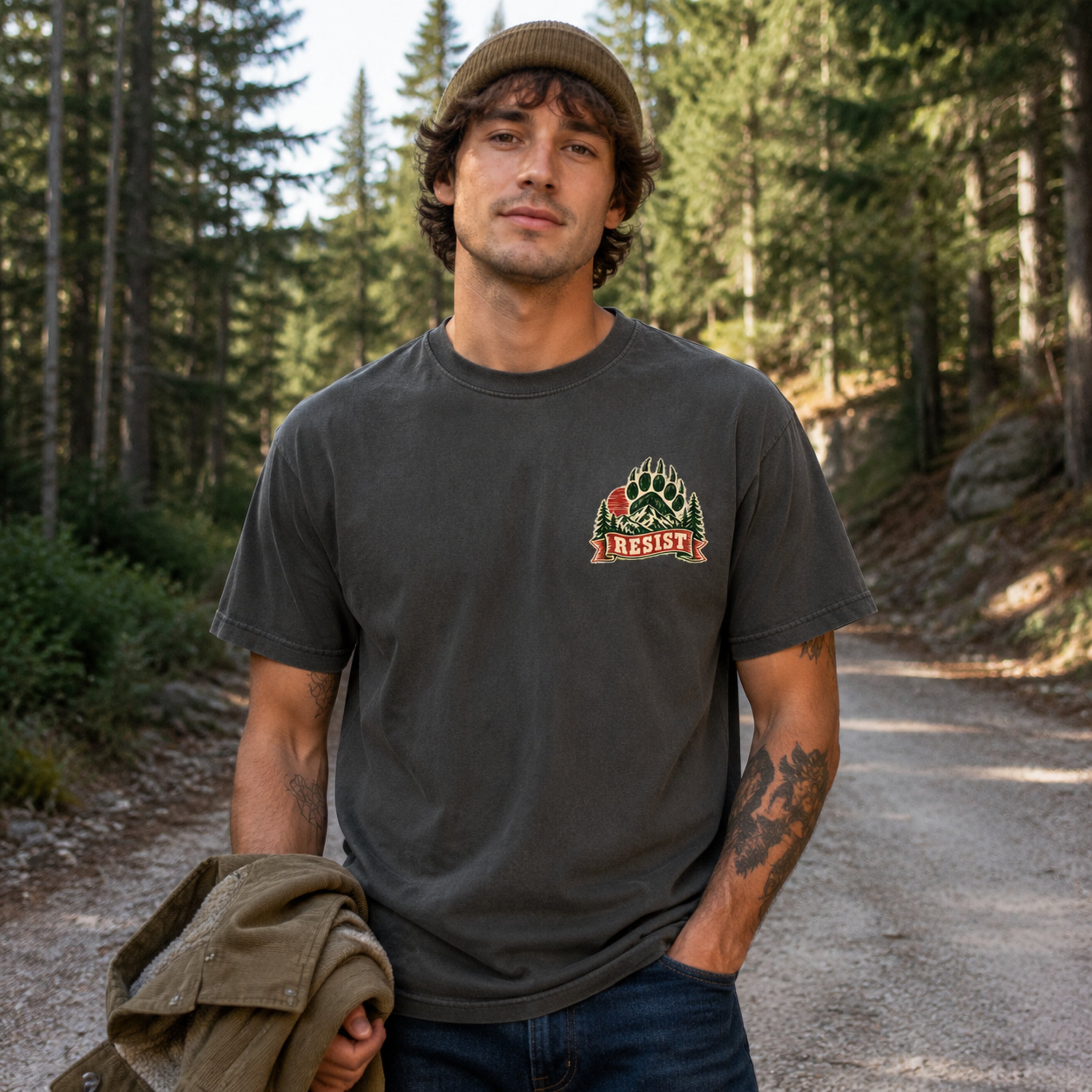 Model wearing Resist Bear Comfort Colors 1717 Pepper tee with small front chest print