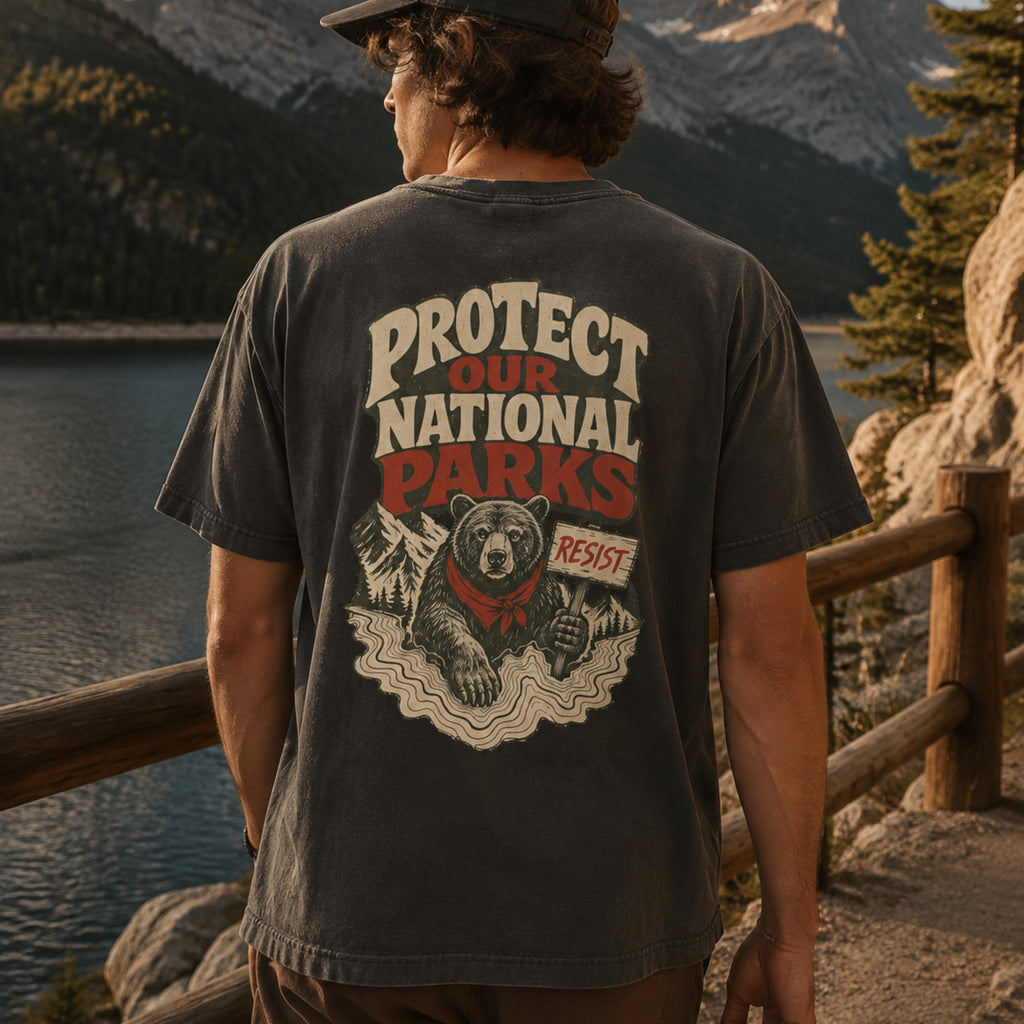 Model wearing Resist Bear Protect Our National Parks Comfort Colors 1717 Graphite tee from back
