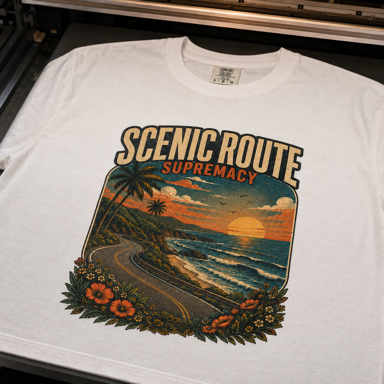 Scenic Route Supremacy coastal artwork printed into white Comfort Colors cotton on a DTG printer platen